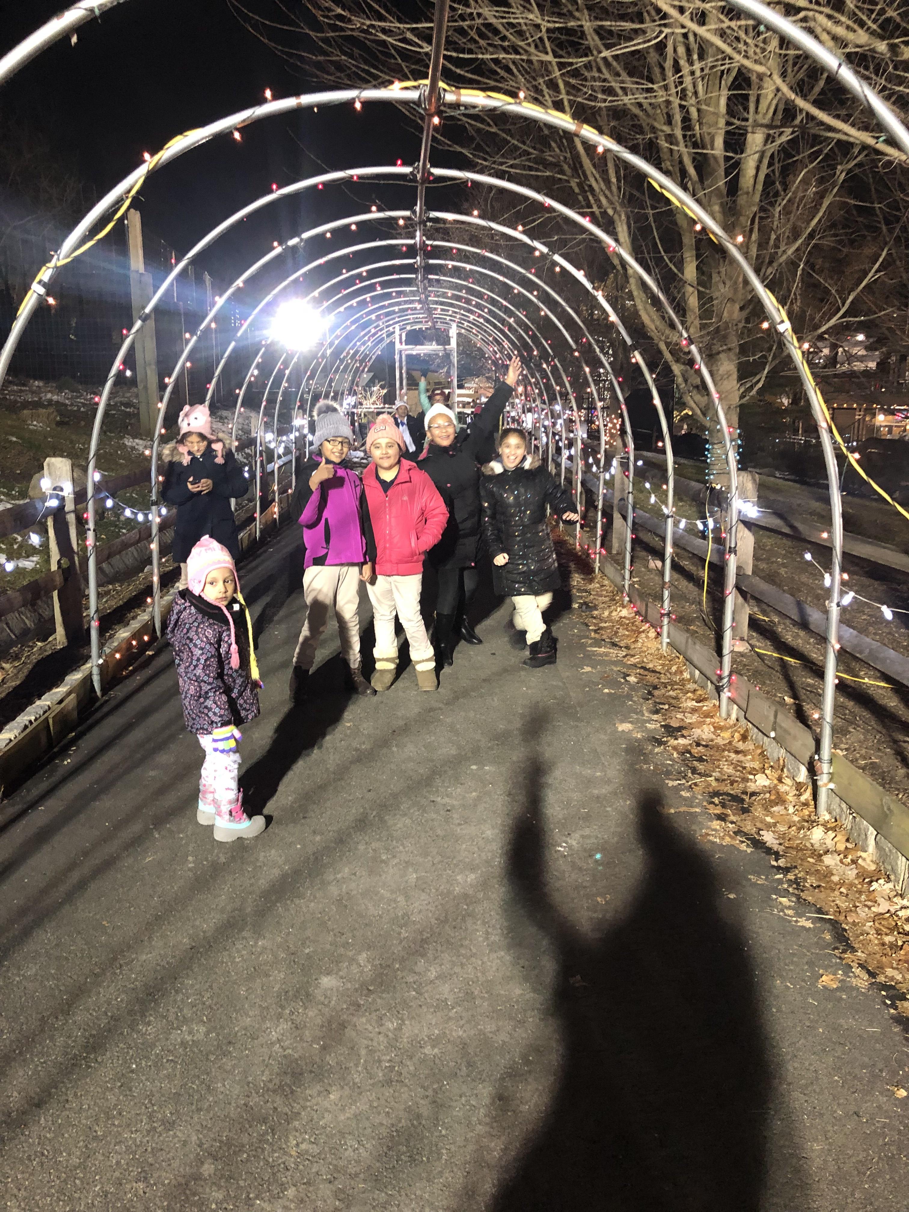 kids walking in the light tunnel