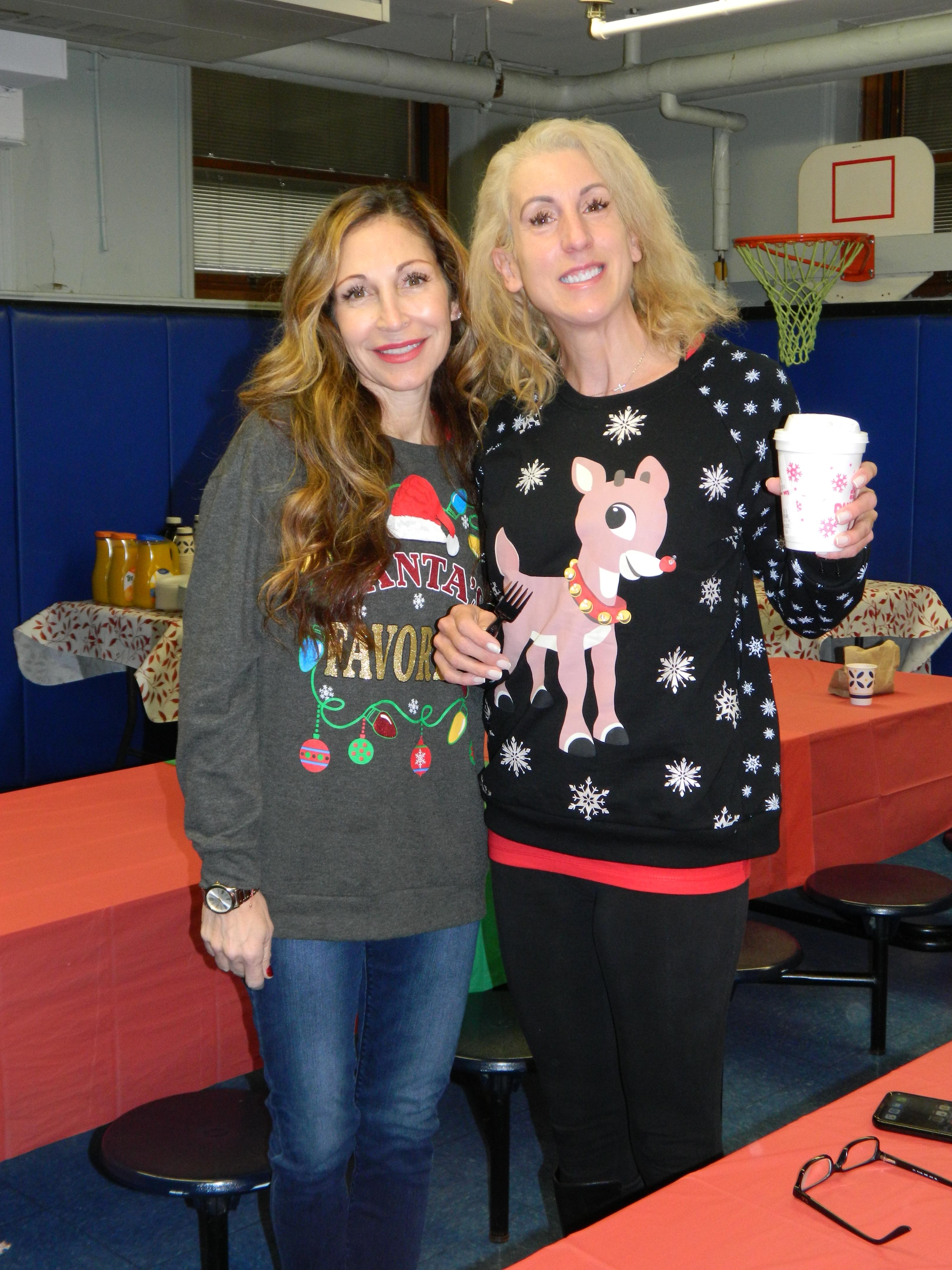 Ms. Rodriguez and Ms. Marone wearing Christmas Sweaters
