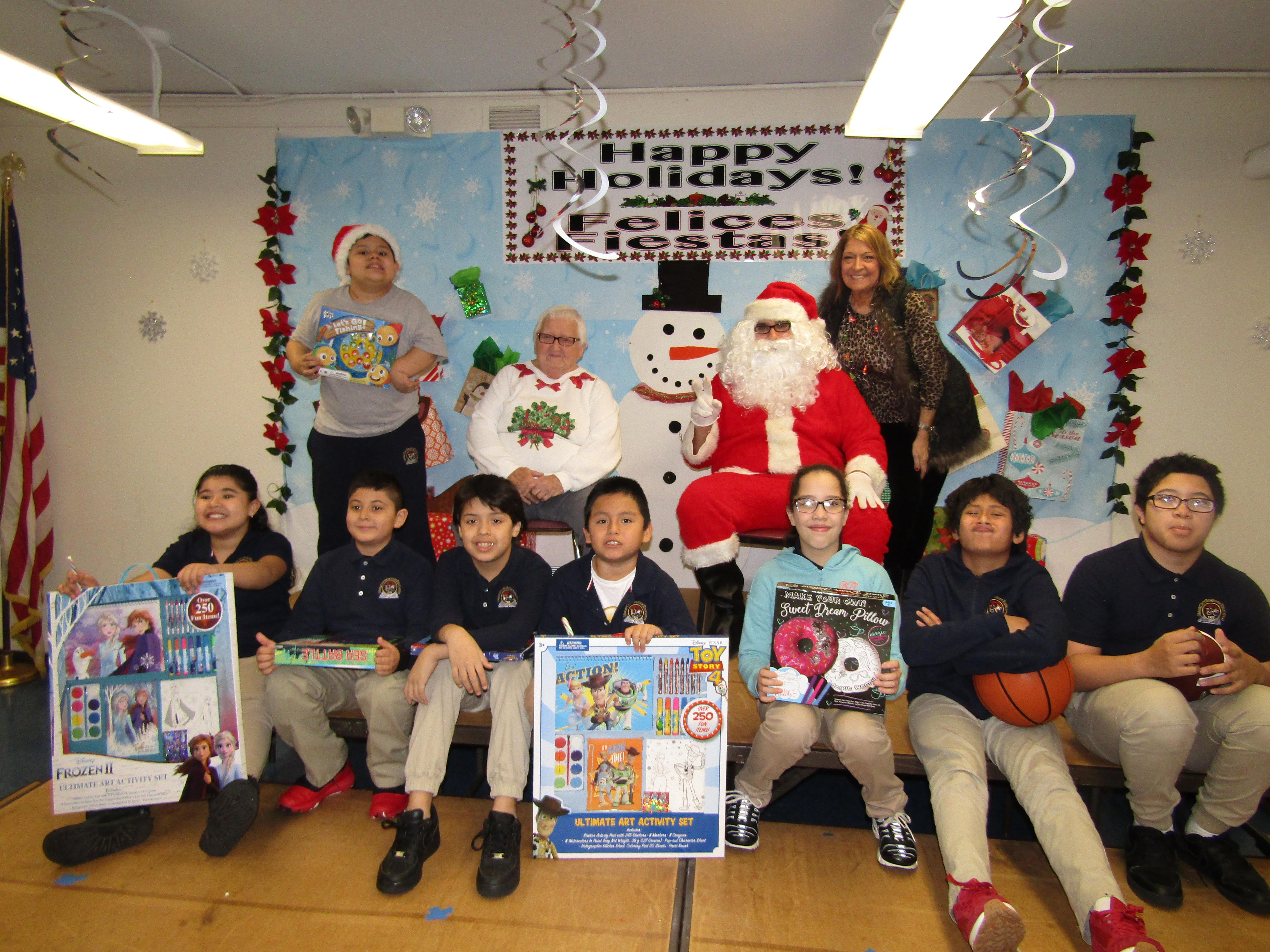 3rd grade class with their gifts from Santa